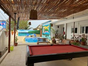 a pool table in the middle of a patio at Paradise Agua Leve Residential in São Tomé