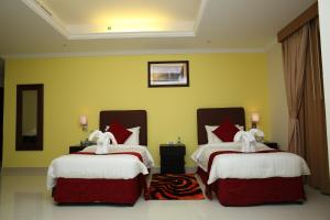 Voodi või voodid majutusasutuse Mirage Hotel Al Aqah toas