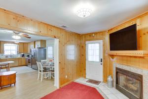 a living room with a fireplace and a television at Peaceful Albany Vacation Rental about 6 Mi to Downtown in Albany