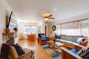 a living room with a couch and a fireplace at Williams Cottage with Patios and Grill Near Route 66 in Williams