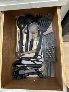 a wooden drawer filled with cooking utensils at Eagles Nest Villa Studio AC TV WIFI Fan Luxury Modern in Albion