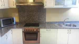 Kuchyňa alebo kuchynka v ubytovaní Apartamento Ático Select Real Caldas de Reis