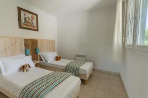 Ένα ή περισσότερα κρεβάτια σε δωμάτιο στο Lagrange Vacances L'Estuaire +33 φωτογραφίες