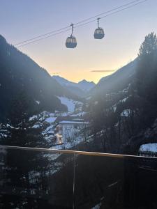 a ski lift with a view of a valley at Biancas Luxury Apartment close Ischgl Spa & Pool in Kappl