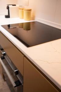 a kitchen counter with two cups on a shelf at La Sorpresa - luxury apartment in historic city center in Arona
