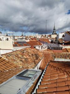 an overhead view of roofs of buildings in a city at Apartments Plaza Mayor, Madrid Center in Madrid