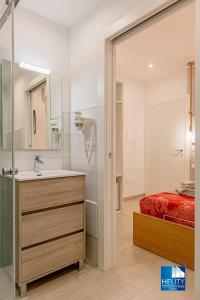 a bathroom with a bed and a sink and a shower at [Tropea]Luxury Terrace Sea Suite in Tropea