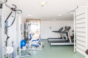 a gym with treadmills and ellipticals in a room at Monumental Nobile- Apart hotel Central in Brasilia