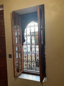 a door with a window in a room at Riad Amalia in Marrakech