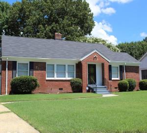 a brick house with a black roof at 3BR, 2BA Hidden Gem in Midtown/Evergreen district in Memphis
