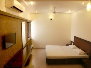 Katil atau katil-katil dalam bilik di Hotel Sai Ramanand