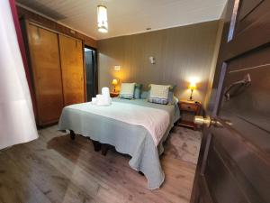 Cama ou camas em um quarto em Hotel El Coihue