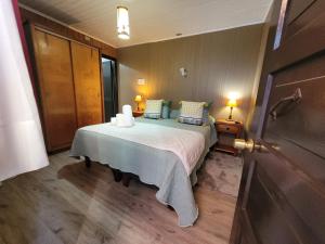 Cama ou camas em um quarto em Hotel El Coihue