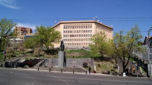 a building with a statue in the middle of a street at CITY VIEW PENTHOUSE in Yerevan