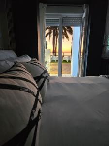 Ein Bett oder Betten in einem Zimmer der Unterkunft HOSTAL LUXURY NIT I DIA
