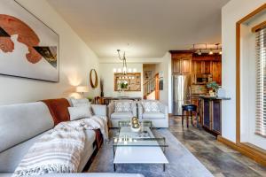a living room with a couch and a table at Central 2BR with Prime Amenities in Whistler