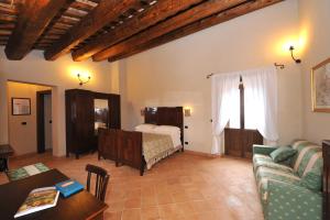 Postel nebo postele na pokoji v ubytování Agriturismo Borgo San Martino