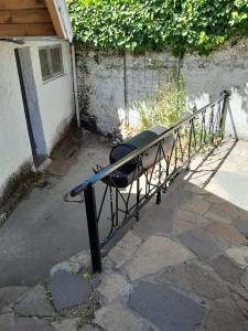 a metal rail with a table in front of a building at Achalay Houses in San Carlos de Bariloche