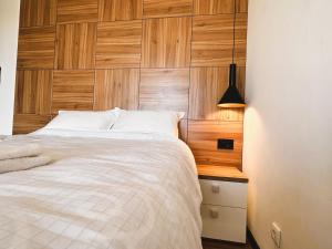 Postel nebo postele na pokoji v ubytování Beli Lotus apartman Borovi