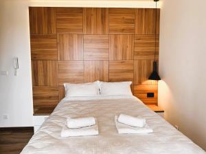 Postel nebo postele na pokoji v ubytování Beli Lotus apartman Borovi