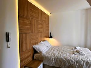 Postel nebo postele na pokoji v ubytování Beli Lotus apartman Borovi