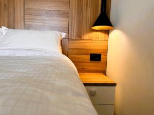 Postel nebo postele na pokoji v ubytování Beli Lotus apartman Borovi