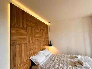 Postel nebo postele na pokoji v ubytování Beli Lotus apartman Borovi