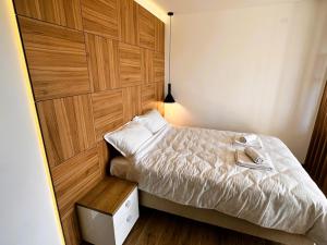Postel nebo postele na pokoji v ubytování Beli Lotus apartman Borovi