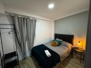Postel nebo postele na pokoji v ubytování Loft Jerez