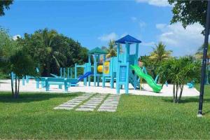 a park with a playground with a slide at Chesapeake Place @ Palm Cay Resort in Nassau