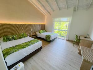 Ένα ή περισσότερα κρεβάτια σε δωμάτιο στο Hotel Barranqueros Soledén