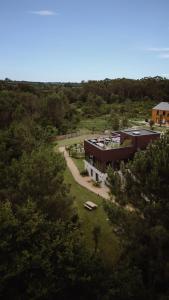 an aerial view of a large building in a forest at HEJMO in Hossegor