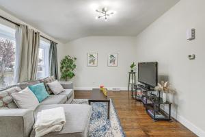 a living room with a couch and a tv at 2-Story Lawnside Home 13 Mi to Dtwn Philadelphia! 