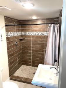 a bathroom with a shower and a sink at McKinney Farmers market Home in McKinney