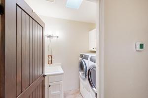 a laundry room with a washer and dryer at Saguaro Sunrise in Tucson +17 photos