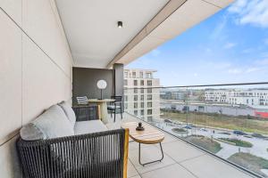 A seating area at Luxurious 1-BR Apt in Gasperich, Luxembourg