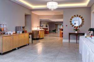 a large room with a salon with a mirror at Best Western Appleby Park Hotel in Tamworth