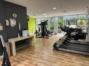 a gym with a treadmill and exercise equipment in a room at Hotel - São Paulo AV Paulista in Sao Paulo