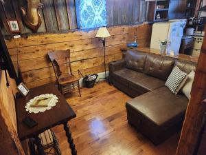 a living room with a couch and a table at The Stable at Windmill Ridge Farm in Fredonia