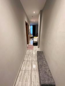 a hallway of a house with white walls and wooden floors at Mayata Pera in Istanbul