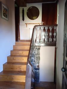 a staircase in a house with a stone stair case at Casa Molily in Llanes