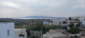 a view of a city with buildings and the ocean at Aegean Moments in Glinado Naxos