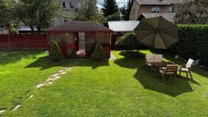 Zahrada ubytování Japandi apartamentai