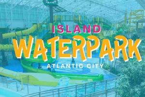 een waterpark op een eiland in een stad met een waterglijbaan bij 2BR 3BA Ocean Front condo on the Boardwalk CozySuites in Atlantic City