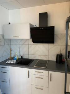 Кухня або міні-кухня у Ferienwohnung Königsstraße mit Waschmöglichkeit, ohne Dusche