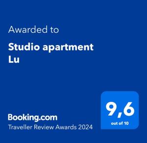 a blue screen with the text awarded to studio apartment lu at Studio apartment Lu in Rupa