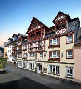 an apartment building in the middle of a street at Hotel Zehnthof in Cochem