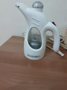 a white blender sitting on top of a wooden table at Camp Humphreys pyeongtaek's sharing house in Pyeongtaek