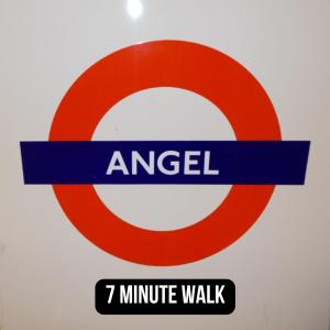 a red and white sign with a minute walk at Chapel Manor Large 2 Bed Flat Zone 1 in London