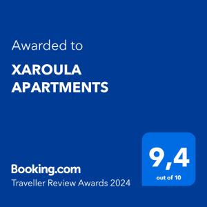 a blue text box with the words awarded to karolina apartments at XAROULA APARTMENTS in Ierissos